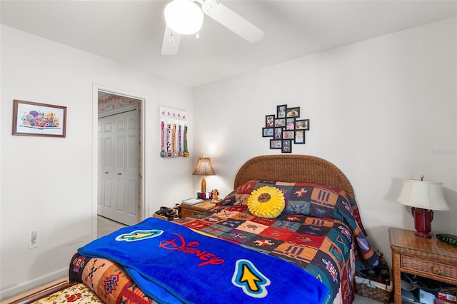 bedroom featuring ceiling fan and a closet