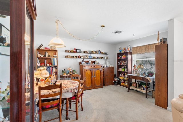 dining area with light carpet