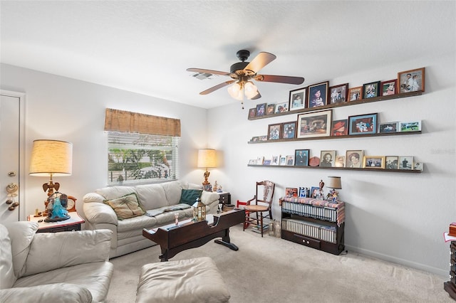 living room featuring light carpet and ceiling fan