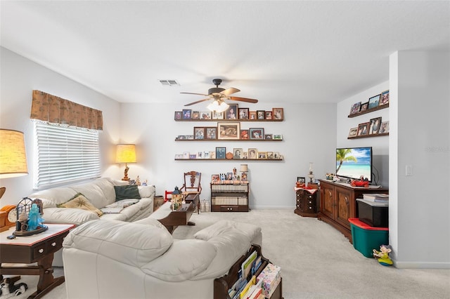 carpeted living room with ceiling fan