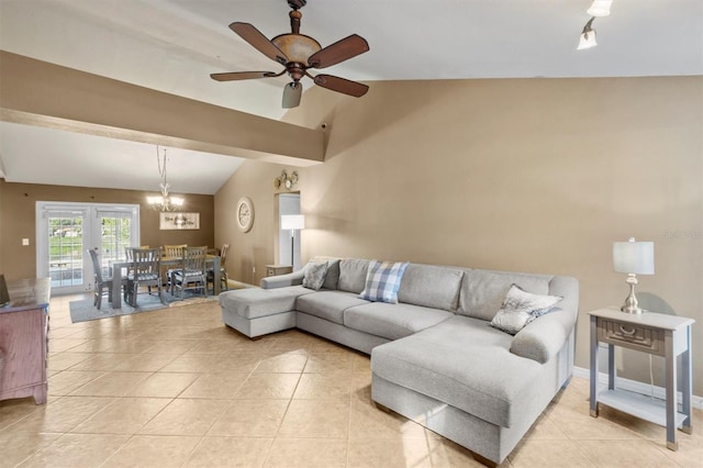 tiled living room with vaulted ceiling and ceiling fan with notable chandelier