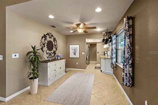 interior space featuring light tile floors