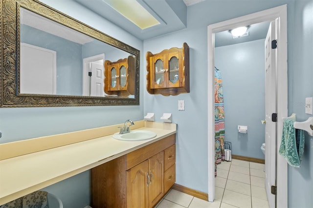 bathroom featuring vanity, toilet, and tile floors