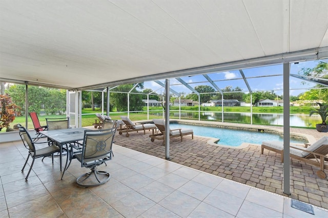 sunroom with plenty of natural light and a water view