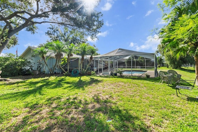 view of yard featuring glass enclosure