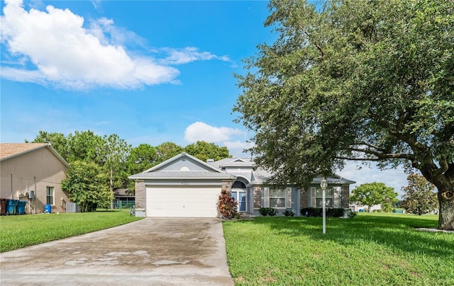 view of front facade with a garage and a front yard