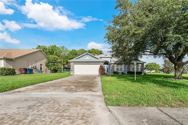 ranch-style house with a garage and a front lawn