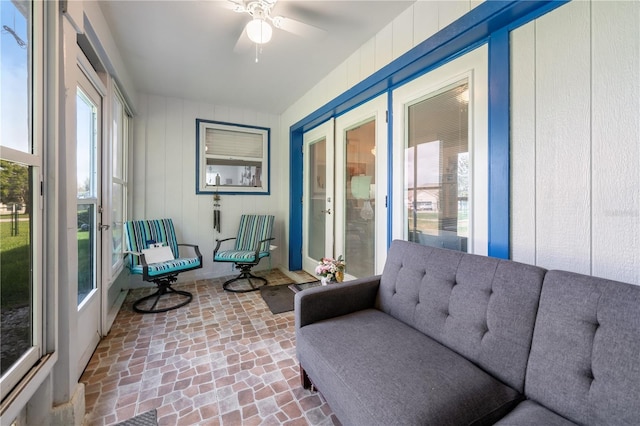 interior space with french doors and ceiling fan