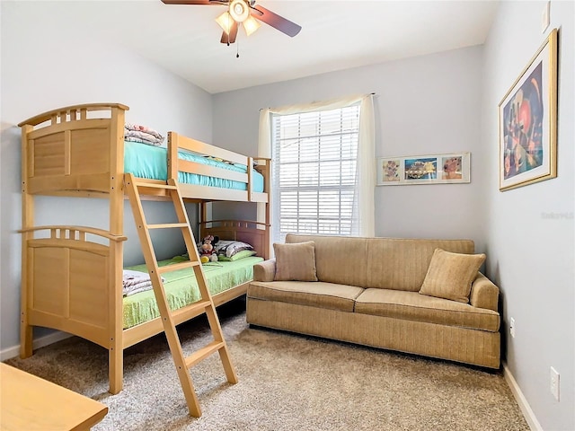 bedroom with ceiling fan and carpet