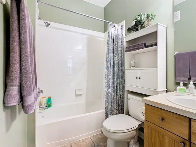 full bathroom featuring tile patterned floors, toilet, shower / bath combo with shower curtain, and vanity