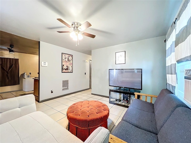 living room featuring ceiling fan and light tile patterned floors