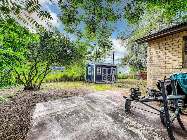 view of patio with a storage shed