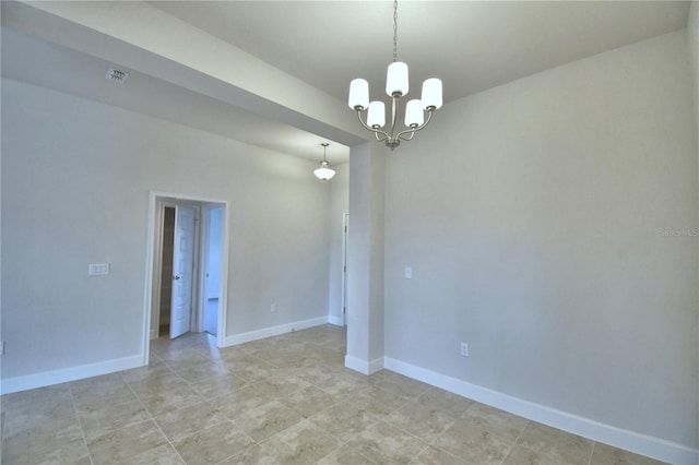 tiled empty room featuring a chandelier