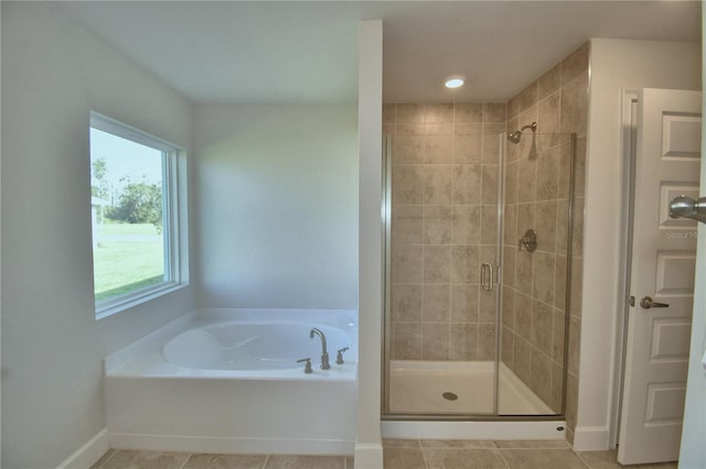 bathroom featuring separate shower and tub and tile patterned flooring