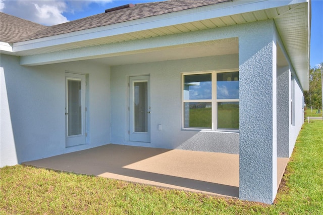 rear view of property featuring a patio area