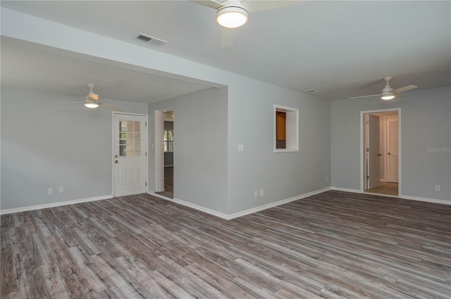 empty room featuring hardwood / wood-style flooring and ceiling fan