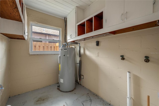 utility room with electric water heater