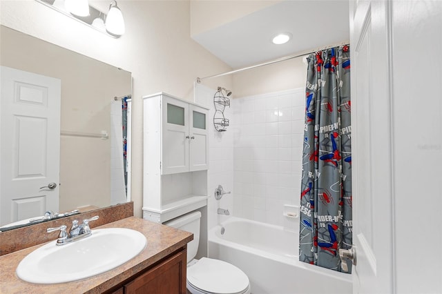 bathroom with shower / tub combo, vanity, and toilet