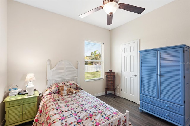 bedroom featuring dark wood-style floors, baseboards, and a ceiling fan