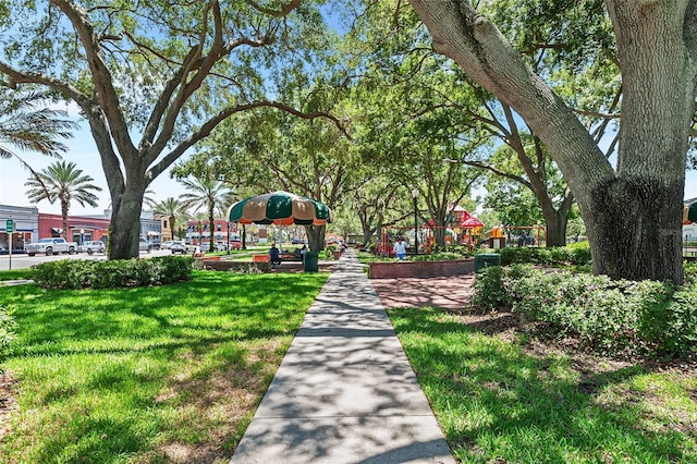 view of home's community with a yard