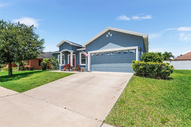 ranch-style home with a front yard and a garage