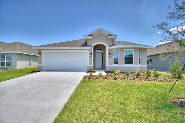 view of front of home with a garage and a front yard