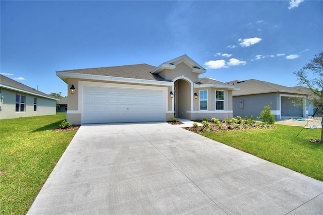 view of front of property featuring a garage and a front yard