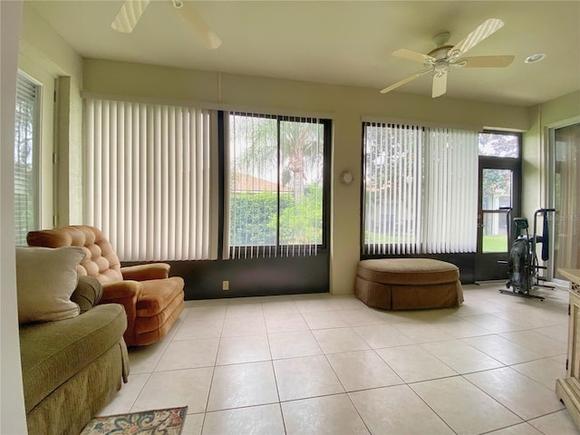 sunroom featuring ceiling fan