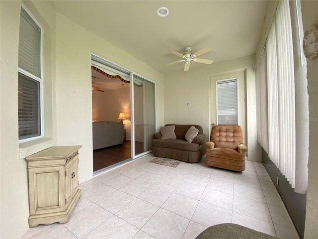 sunroom / solarium with ceiling fan