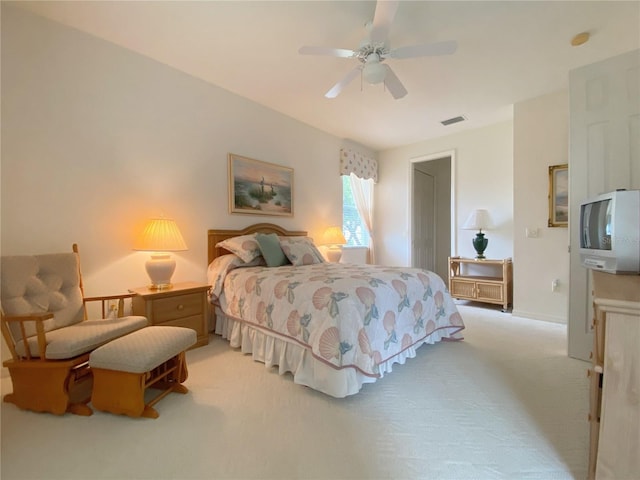 bedroom with light colored carpet and ceiling fan