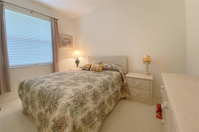 bedroom with light colored carpet