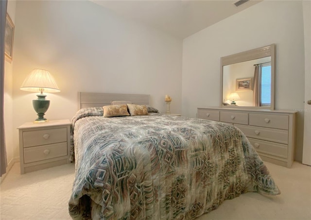 bedroom featuring light colored carpet