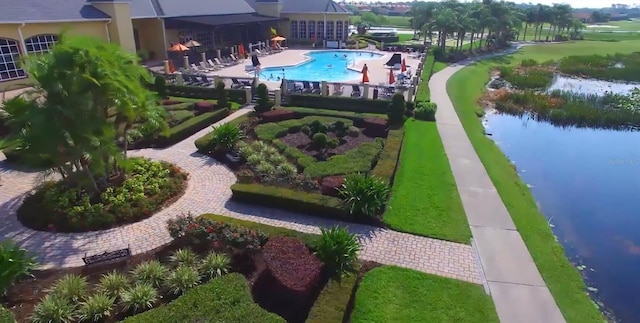 birds eye view of property with a water view