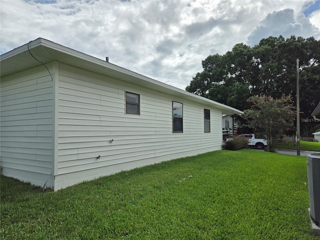 view of property exterior with a yard