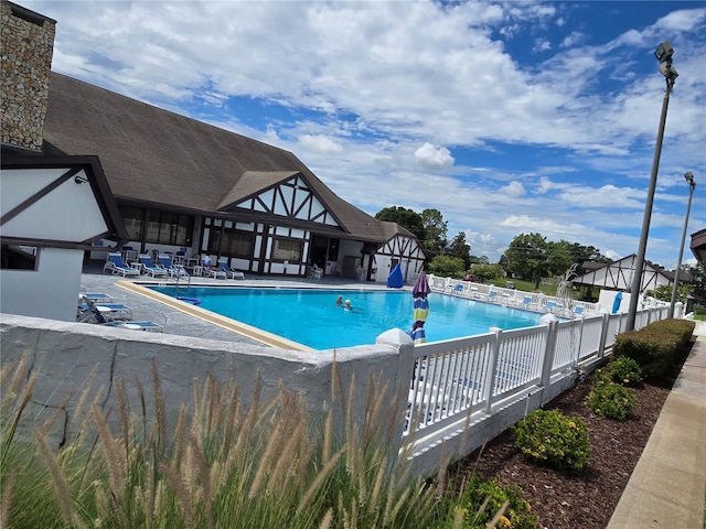 view of swimming pool with a patio area