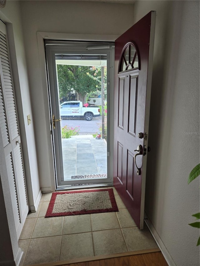 foyer featuring light tile patterned floors