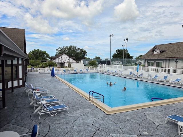 view of swimming pool featuring a patio area