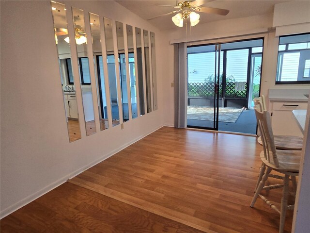 3130 Prairie Dunes Cir W, Lakeland, FL 33810 - unfurnished dining area featuring a ceiling fan, wood finished floors, and baseboards