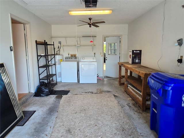 garage with a garage door opener, washer and clothes dryer, electric water heater, and ceiling fan