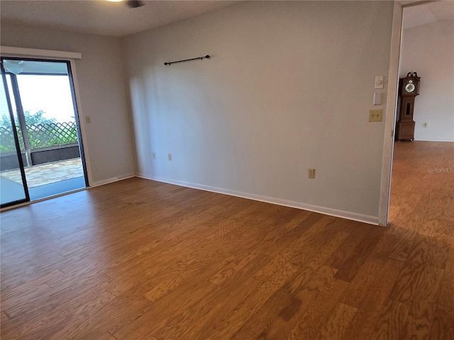 spare room with hardwood / wood-style floors