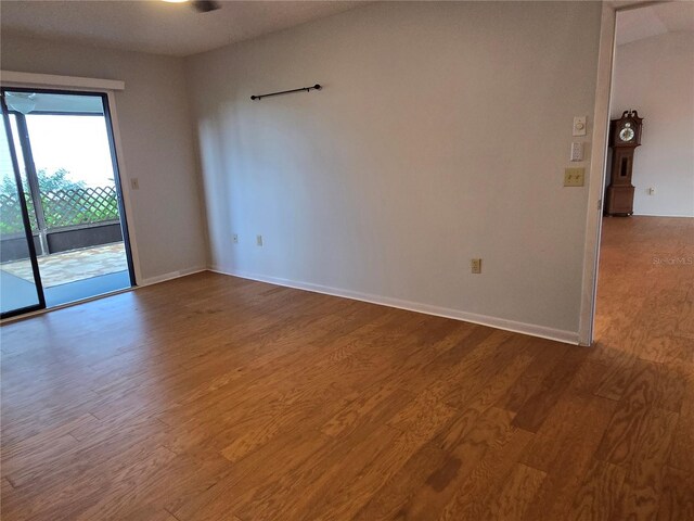 3130 Prairie Dunes Cir W, Lakeland, FL 33810 - empty room with wood finished floors and baseboards