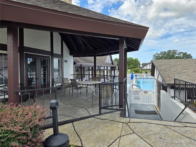 3130 Prairie Dunes Cir W, Lakeland, FL 33810 - view of patio / terrace featuring french doors and a community pool