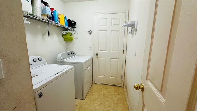 laundry room featuring separate washer and dryer