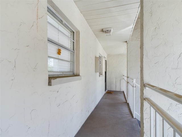 hall with concrete floors