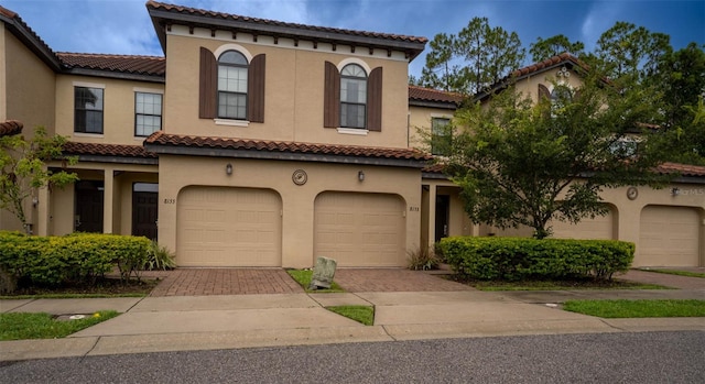 mediterranean / spanish-style house featuring a garage