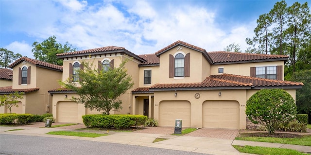 mediterranean / spanish-style house featuring a garage