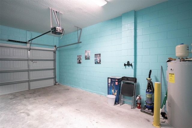 garage featuring water heater and a garage door opener