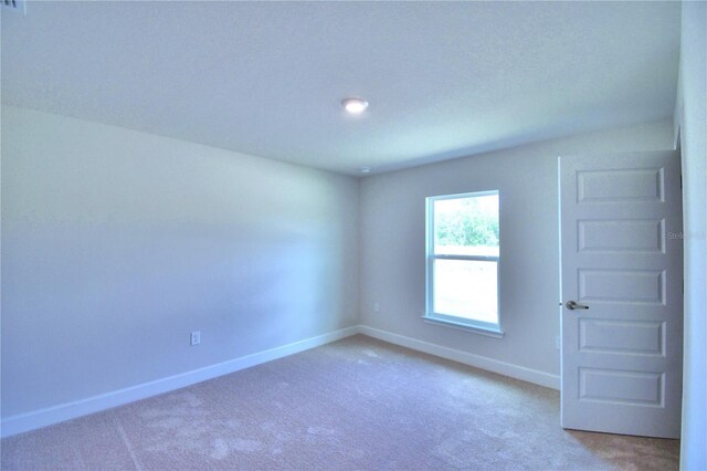 empty room featuring carpet floors