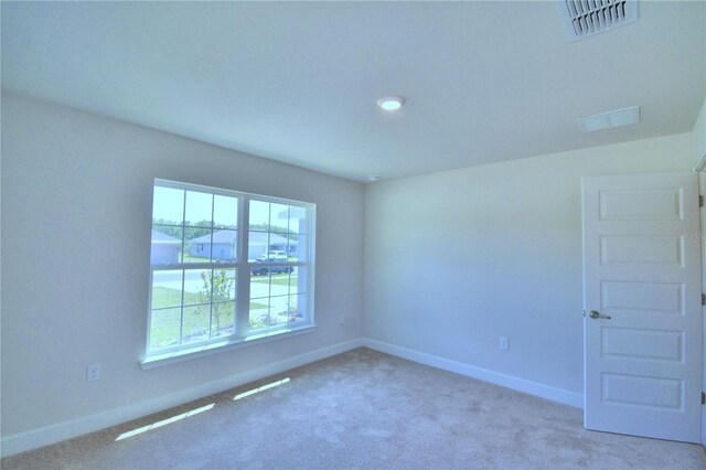 empty room with carpet flooring