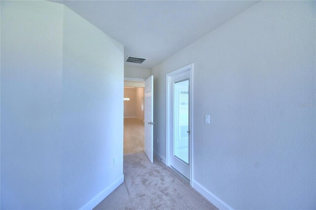 hallway with light carpet